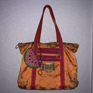 Orange a coach purse with watermelon wristlet